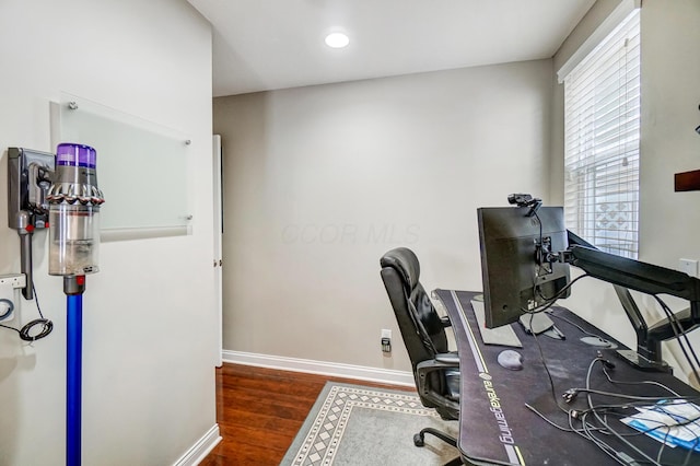 office area featuring dark wood-type flooring