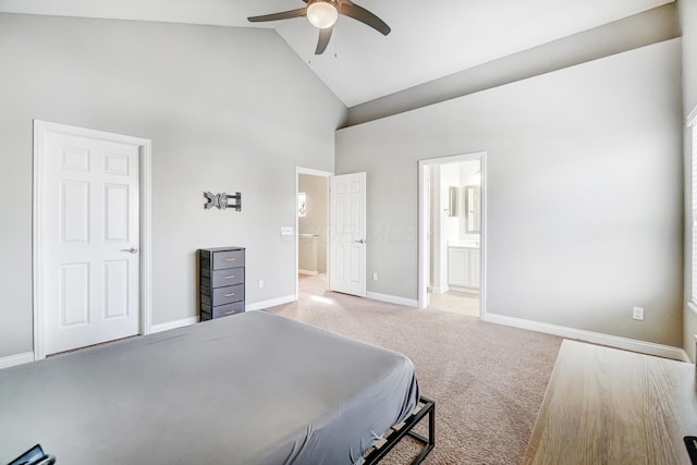 bedroom featuring ensuite bathroom, light colored carpet, ceiling fan, and high vaulted ceiling