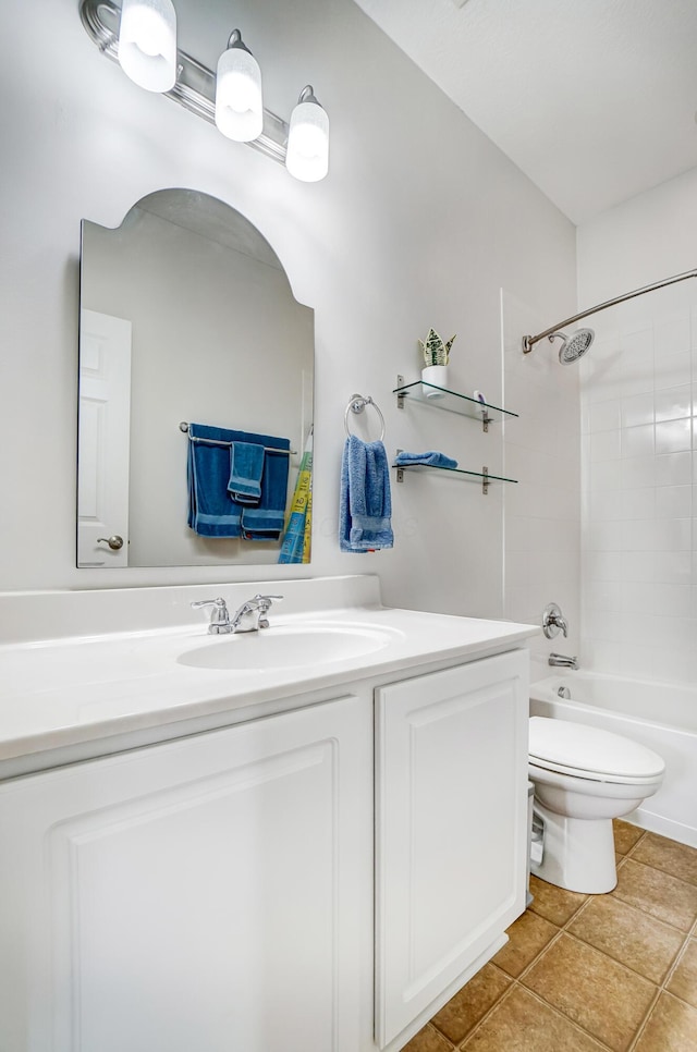 full bathroom with tiled shower / bath, vanity, toilet, and tile patterned flooring