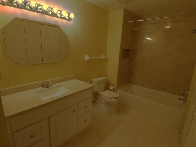 full bathroom featuring vanity, toilet, tiled shower / bath combo, and tile patterned flooring