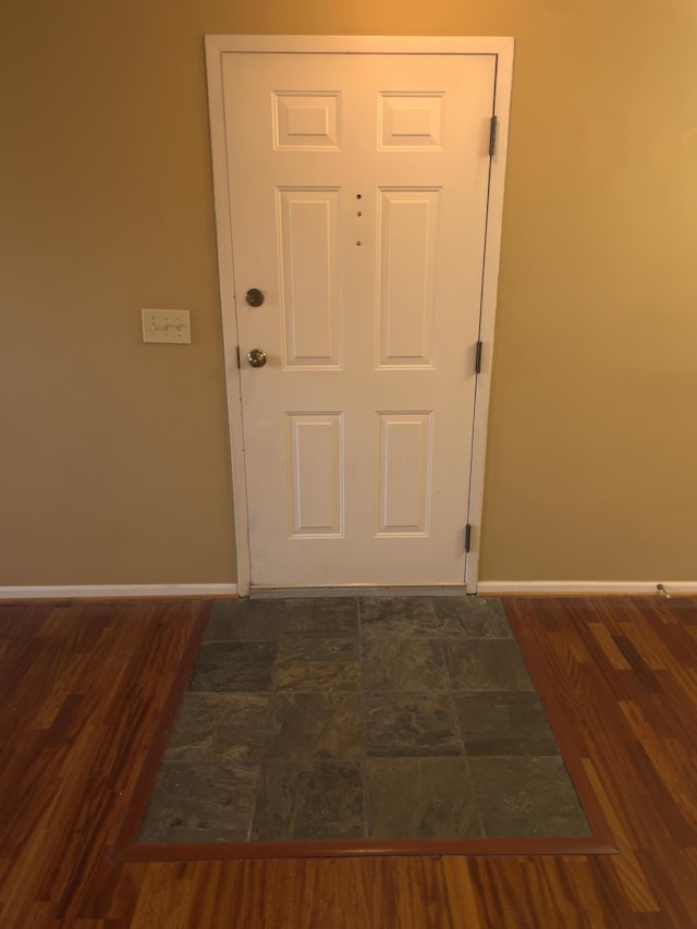 entryway with dark hardwood / wood-style floors