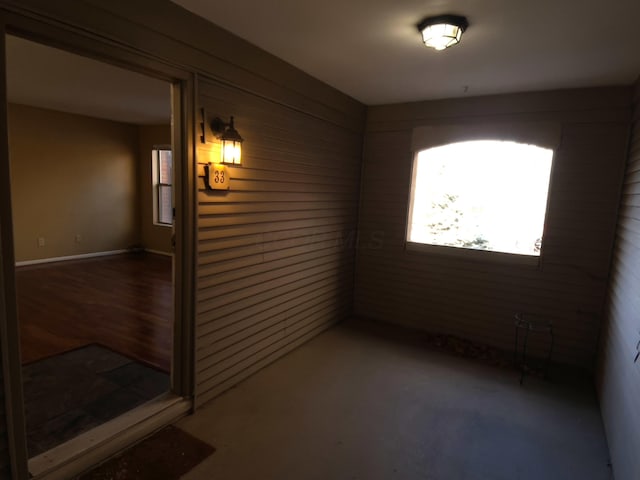 unfurnished room with dark wood-type flooring