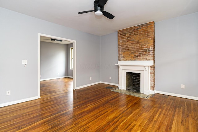 unfurnished living room featuring wood-type flooring, ceiling fan, and a fireplace