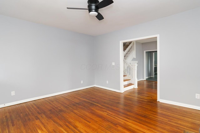 empty room with hardwood / wood-style flooring and ceiling fan