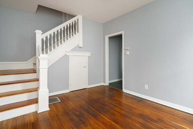 stairway featuring hardwood / wood-style flooring