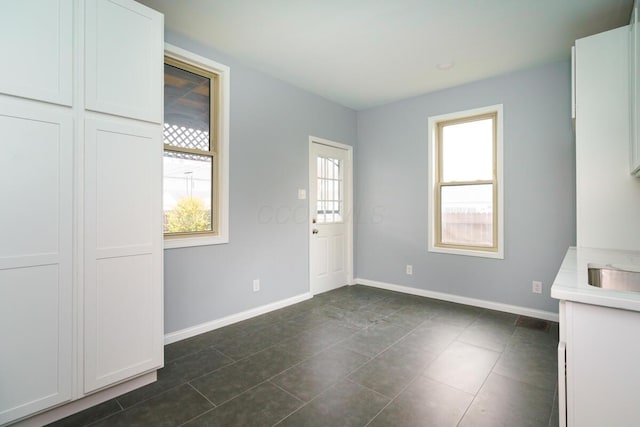 interior space with dark tile patterned flooring