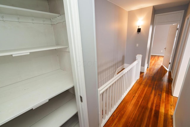 hall with dark hardwood / wood-style floors