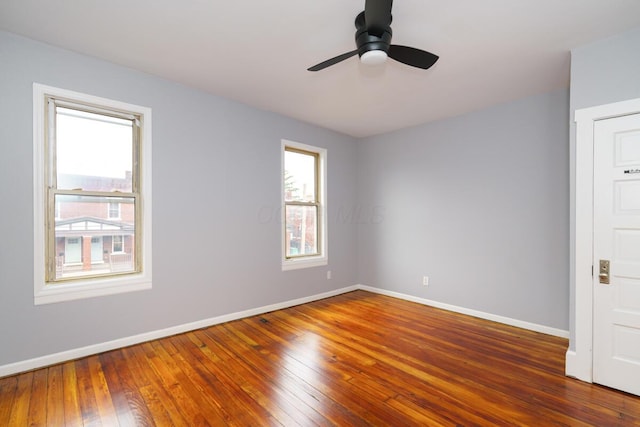 spare room featuring ceiling fan and dark hardwood / wood-style flooring