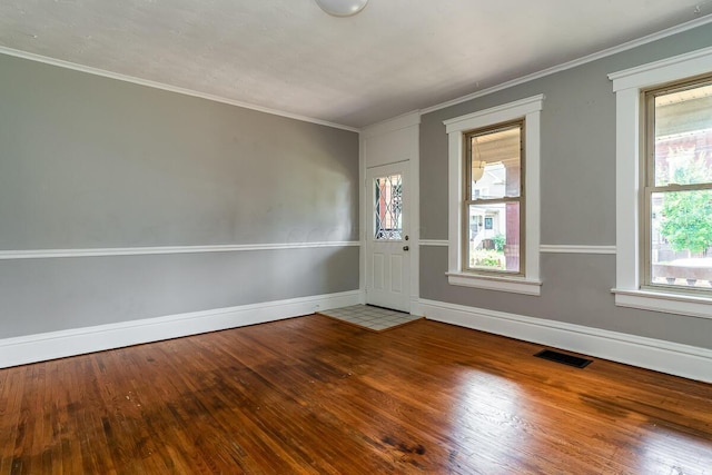 interior space featuring ornamental molding and hardwood / wood-style floors