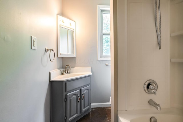 bathroom featuring vanity, tile patterned floors, and washtub / shower combination