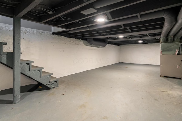 basement featuring heating unit