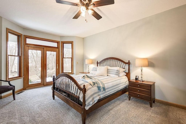 bedroom featuring access to outside, light colored carpet, and ceiling fan