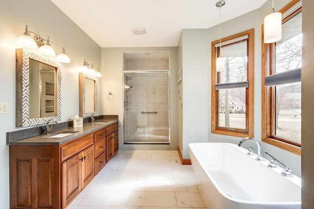 bathroom with vanity and separate shower and tub