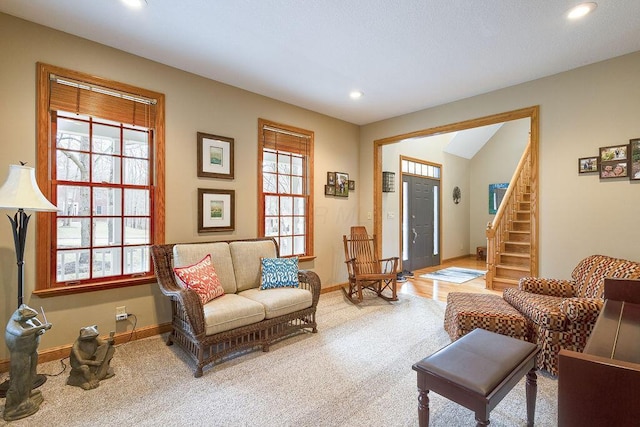 living area with light colored carpet