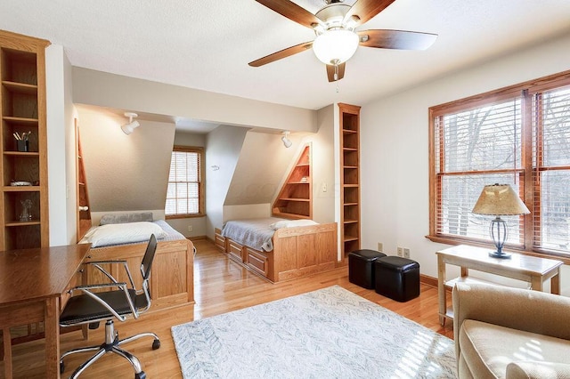 bedroom featuring ceiling fan and light wood-type flooring