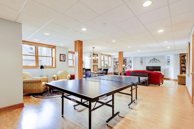 game room with light wood-type flooring