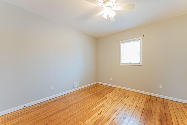 empty room featuring light hardwood / wood-style floors and ceiling fan