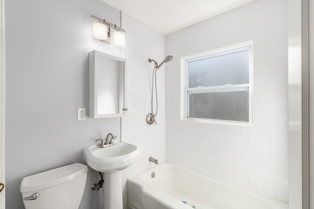 full bathroom featuring toilet and shower / bathtub combination