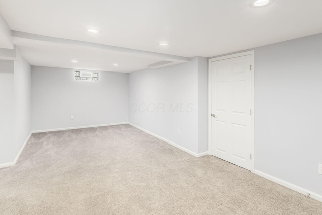 finished below grade area featuring recessed lighting, baseboards, and carpet