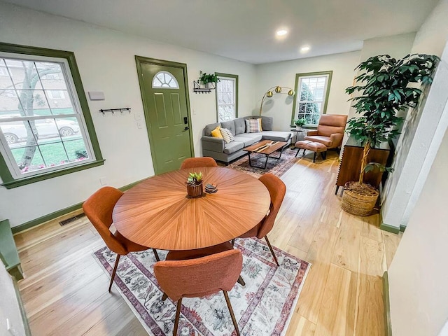 dining area featuring light wood-type flooring