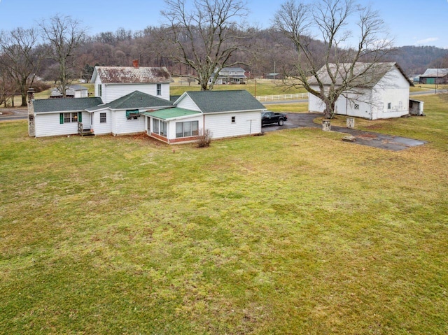 exterior space with a lawn and a chimney