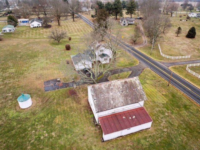 birds eye view of property with a rural view