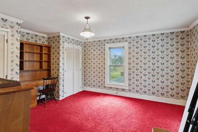 office with wallpapered walls, ornamental molding, dark colored carpet, and a textured ceiling