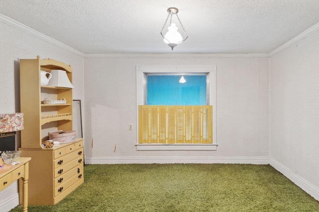 carpeted spare room with a textured ceiling, baseboards, and ornamental molding