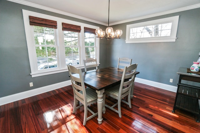 dining space featuring crown molding, dark hardwood / wood-style floors, and a notable chandelier