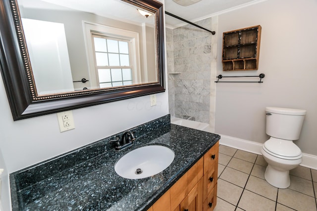 bathroom with vanity, crown molding, tile patterned floors, and toilet