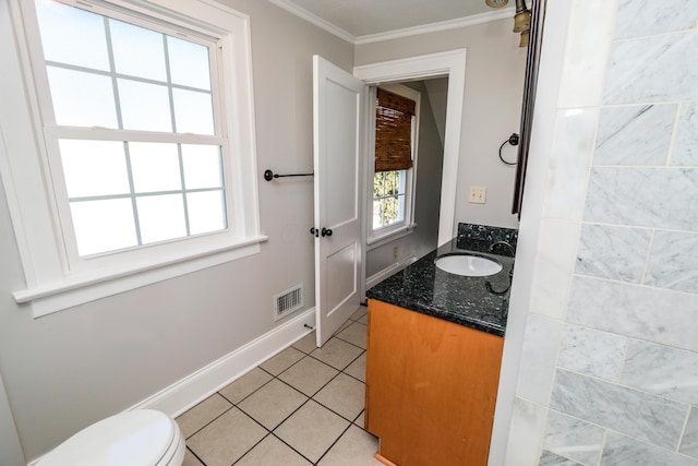 bathroom featuring ornamental molding, vanity, toilet, and tile patterned flooring