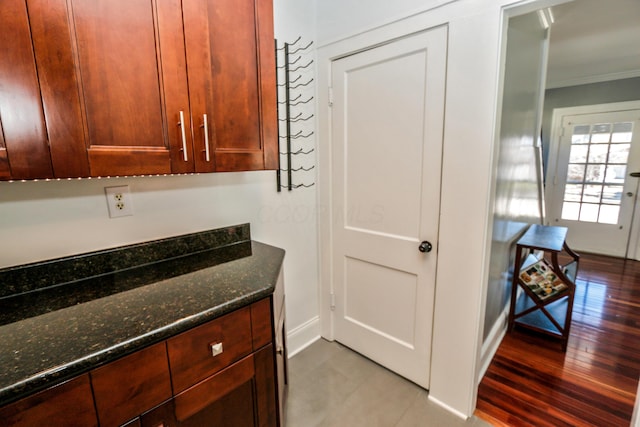 interior space featuring crown molding and hardwood / wood-style flooring