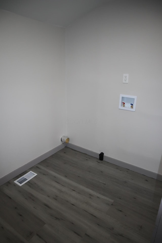 washroom with hardwood / wood-style flooring and washer hookup