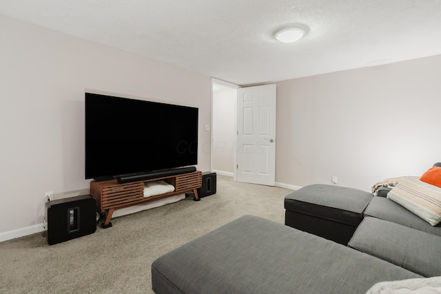 carpeted living room with a textured ceiling