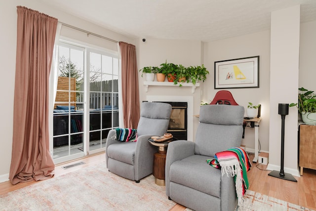 sitting room featuring hardwood / wood-style flooring