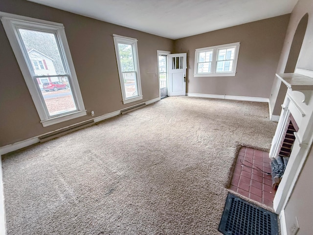 unfurnished living room with carpet