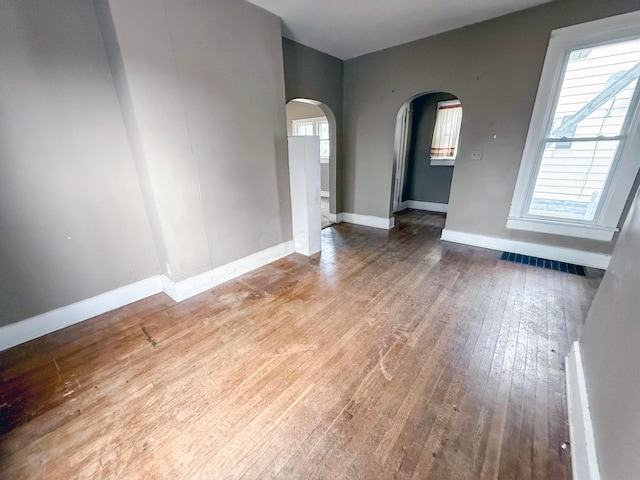 unfurnished room with hardwood / wood-style floors