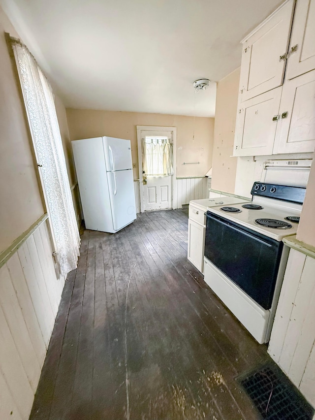 kitchen with white cabinetry, white appliances, and dark wood-type flooring