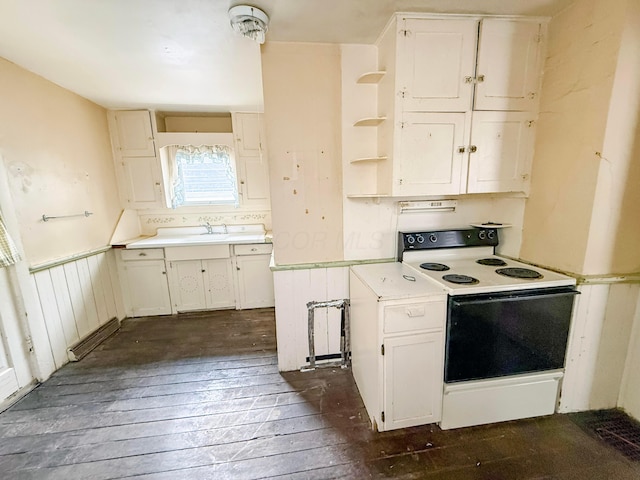 kitchen with dark hardwood / wood-style floors, white cabinets, and white range with electric stovetop