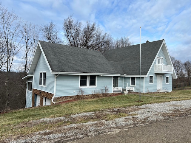 view of front of house with a garage and a front yard