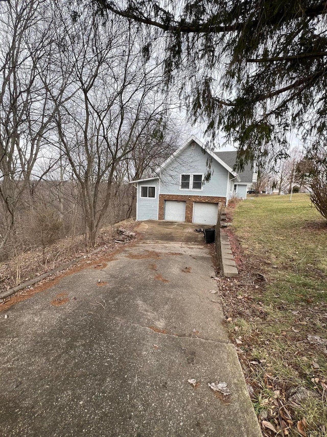 view of side of home with a garage