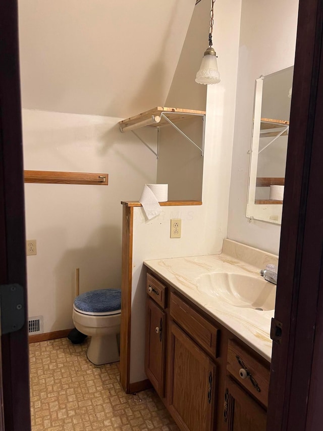 bathroom with vanity and toilet