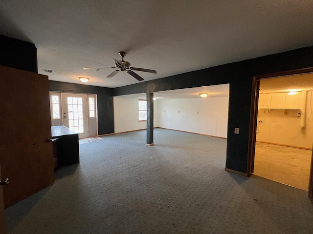 spare room with carpet and ceiling fan