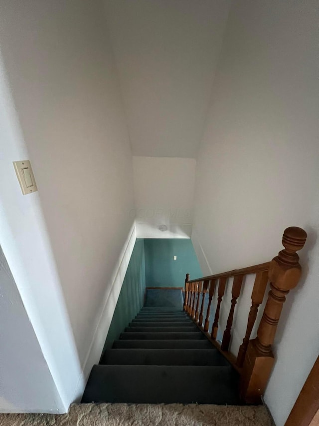 stairs featuring lofted ceiling