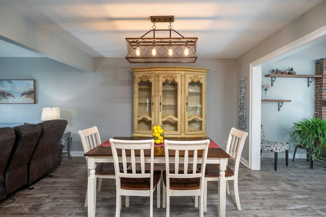 dining room with wood finished floors and baseboards