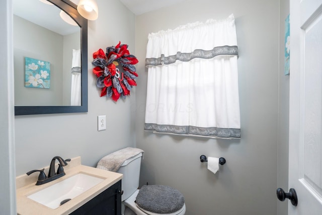 half bath with toilet and vanity