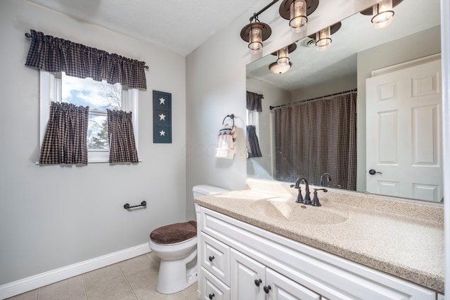 full bath featuring tile patterned flooring, baseboards, vanity, and toilet