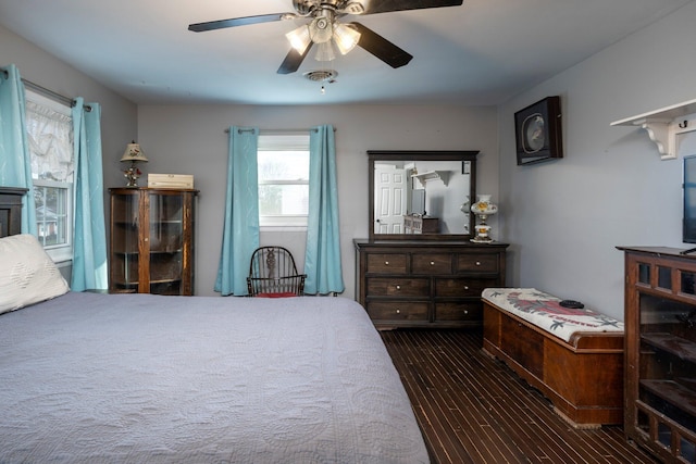 bedroom featuring dark wood-style flooring and a ceiling fan