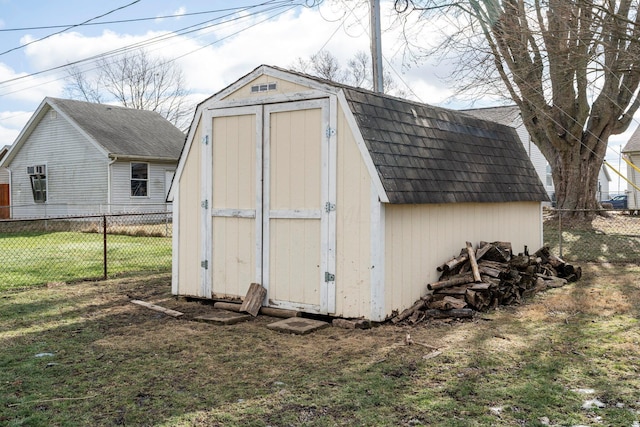 view of shed with fence