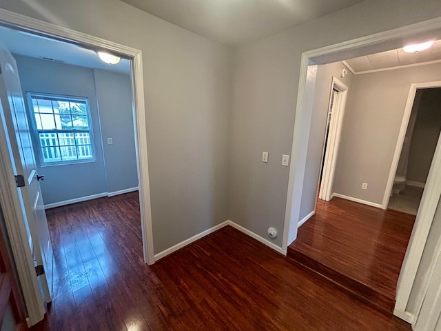 hall with dark hardwood / wood-style floors